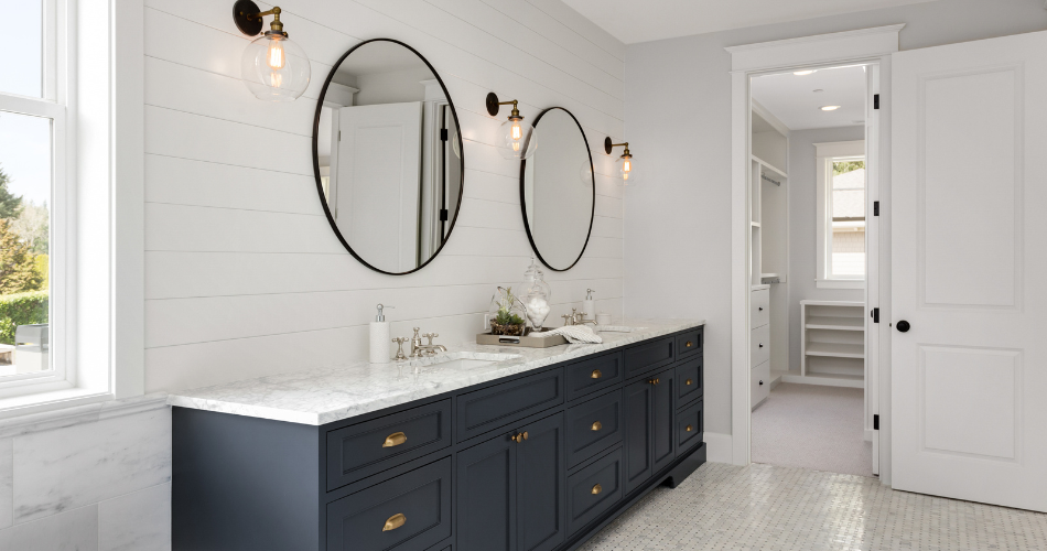 Family-friendly bathroom design with durable quartz countertops, double sinks and adjoining walk-in closet.